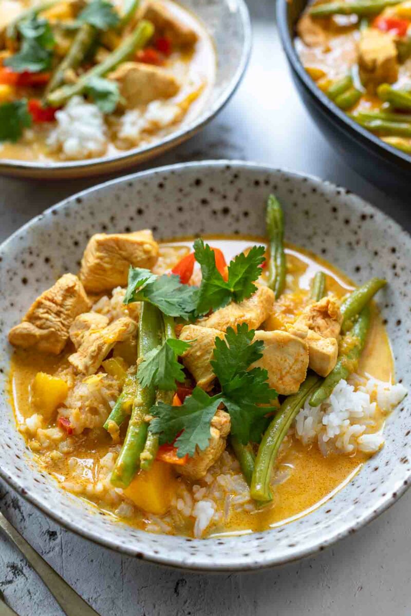 Close up of mango curry with Chicken served over rice