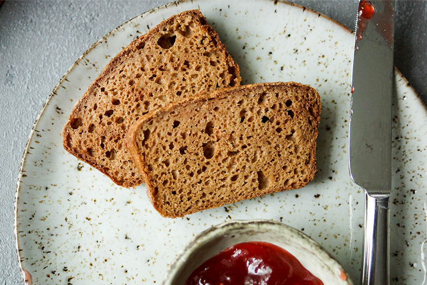 Apple Cardamom Bread on a plate with jam