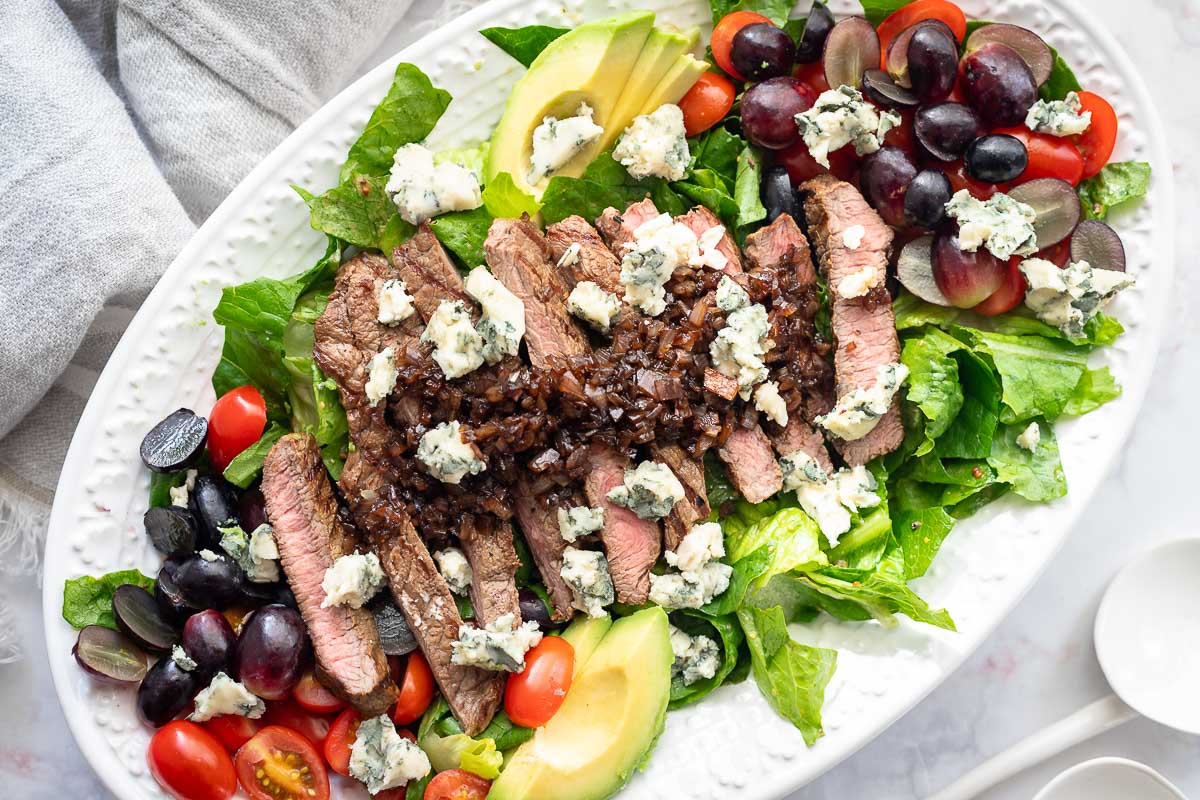 Grilled steak with lettuce and balsamic glaze