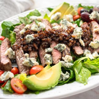 Grilled steak with lettuce and balsamic glaze