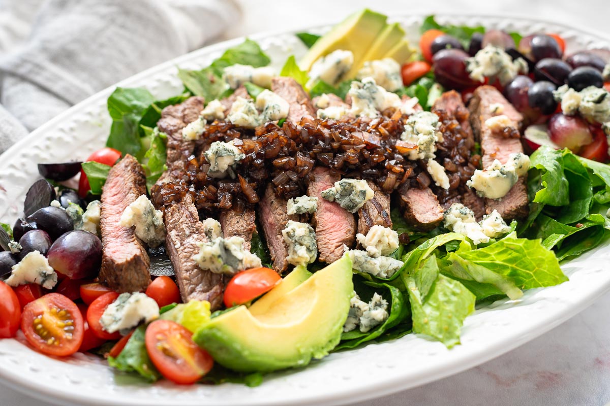 Grilled steak with lettuce and balsamic glaze