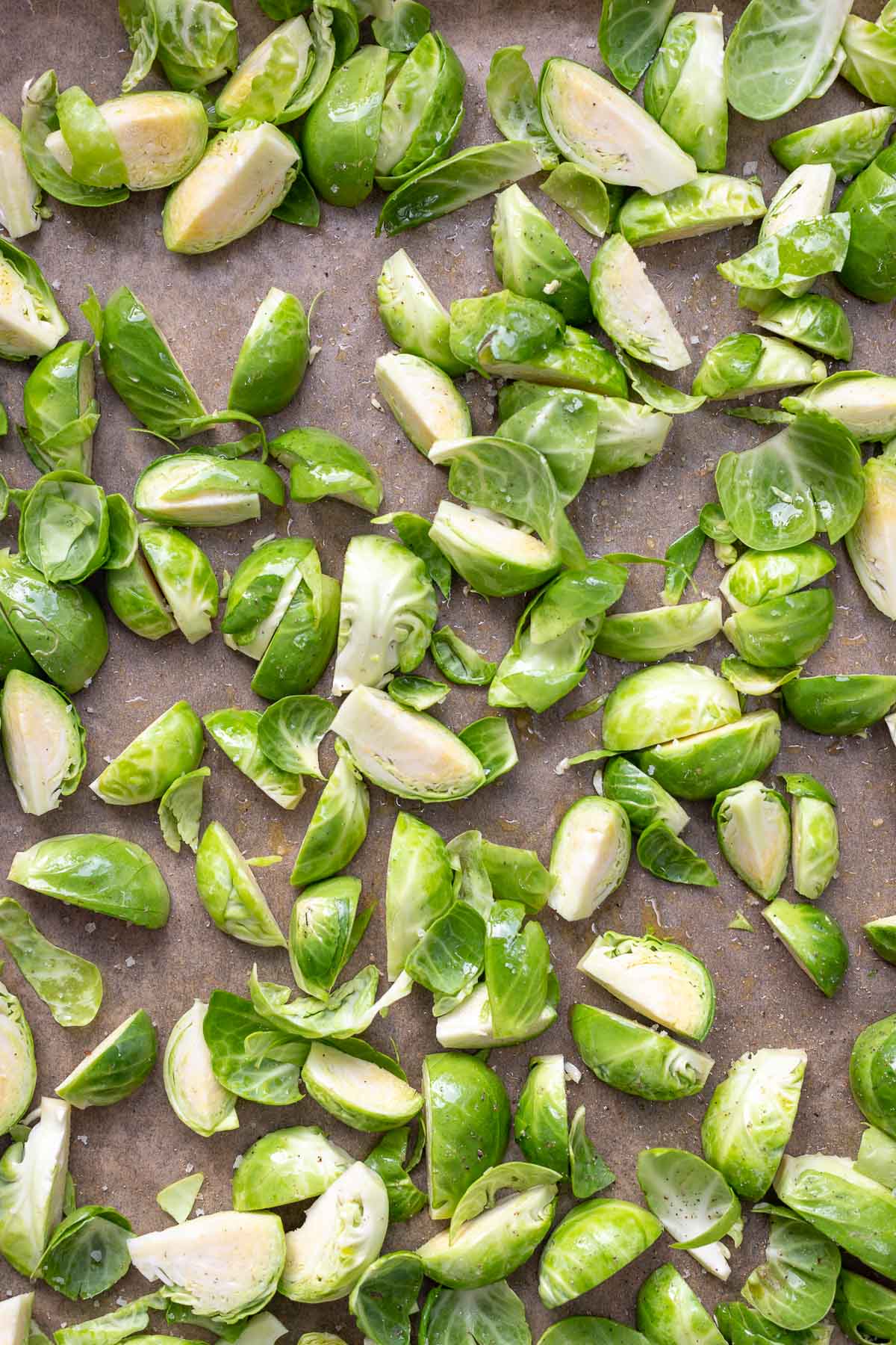 Brussel sprouts quartered on a baking sheet