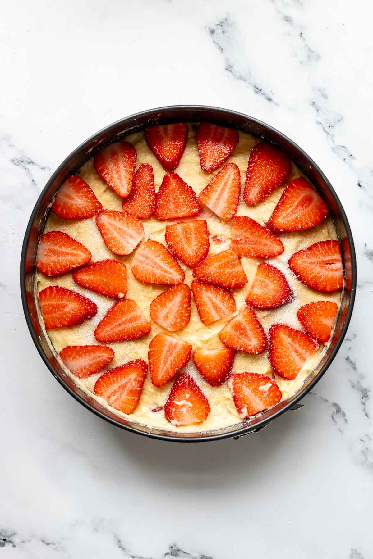preparation steps for cake - strawberries on top