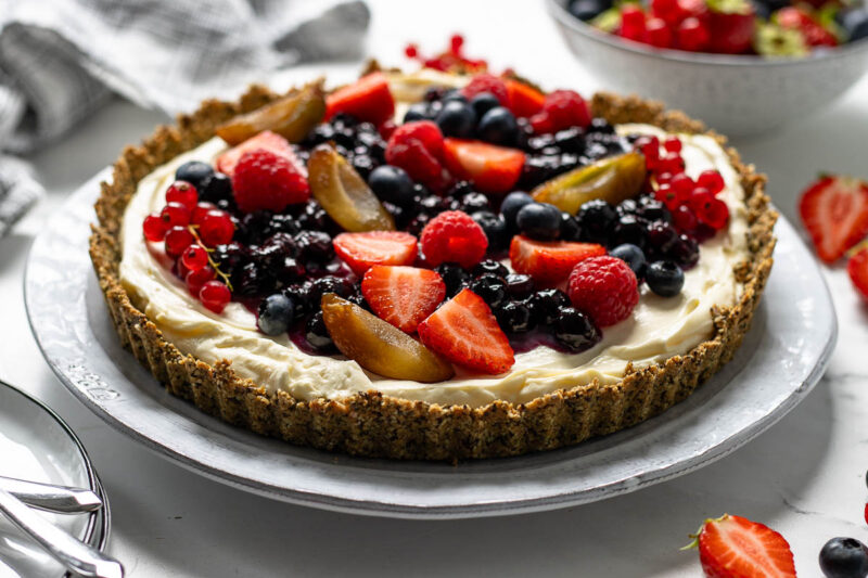 No-bake cheesecake recipe made with condensed milk and topped with berries