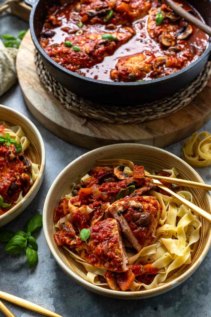 Chicken Cacciatore made with chicken breasts, served with band noodles