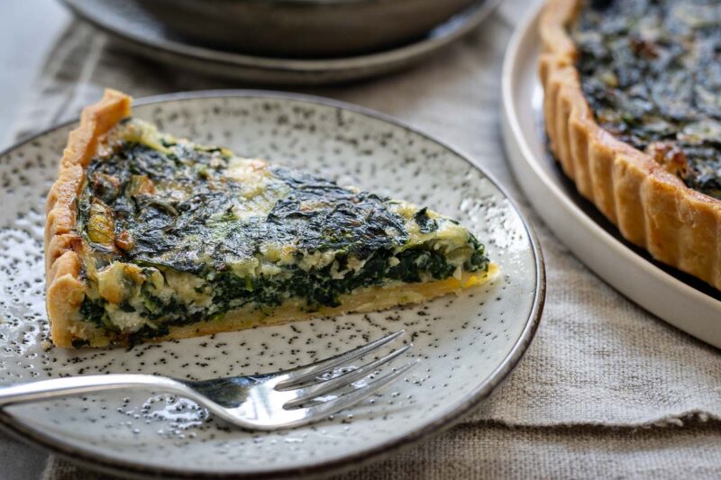 Slice of Spinach Quiche with Gorgonzola, close up