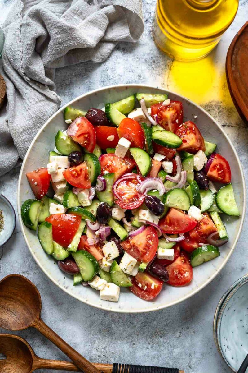 Greek salad recipe made with tomatoes, cucumber, feta, red onion and simple dressing with dried oregano