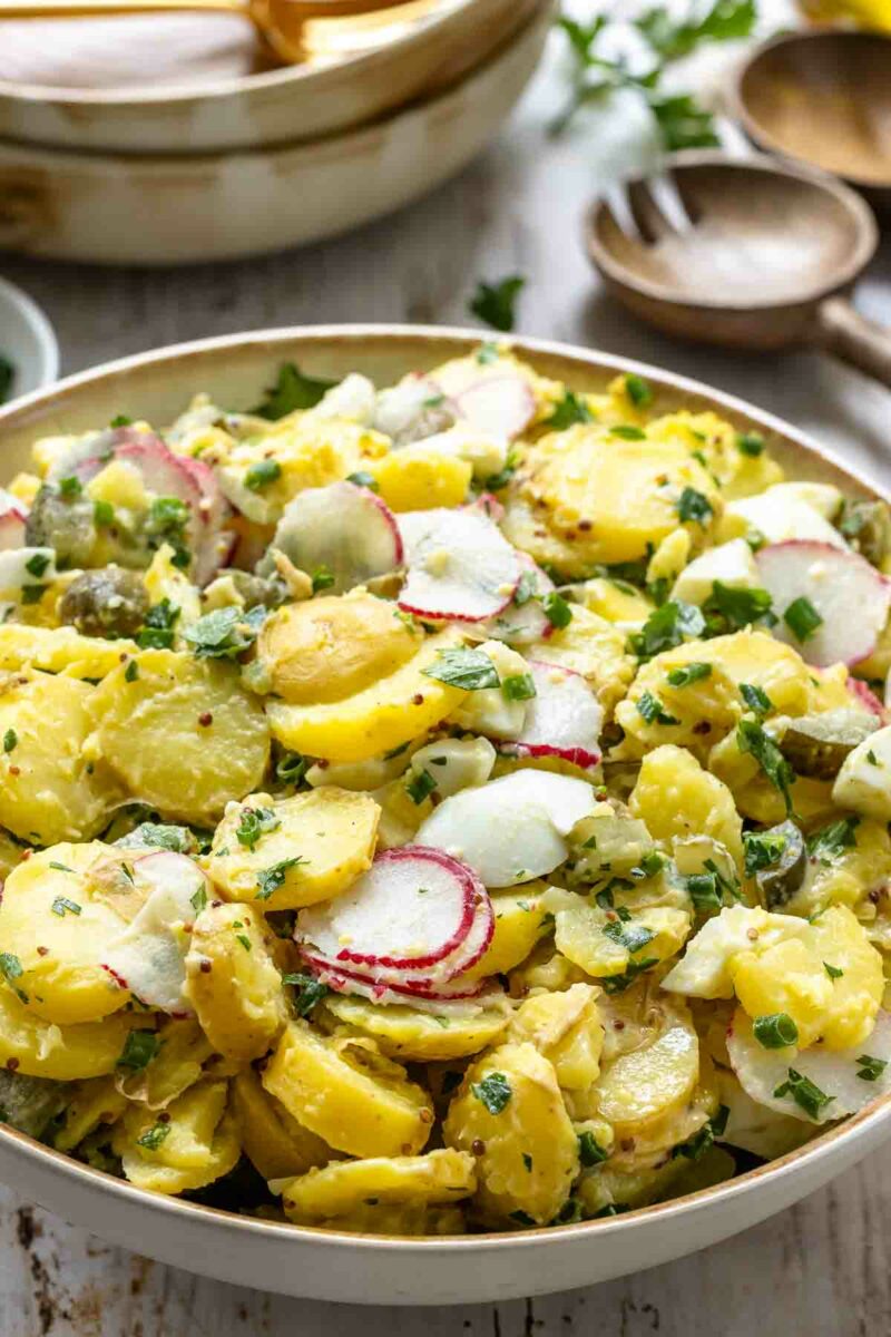 Classic Potato Salad made with creamy mayonnaise, crunchy dill pickles, fresh herbs, and hard-boiled eggs.