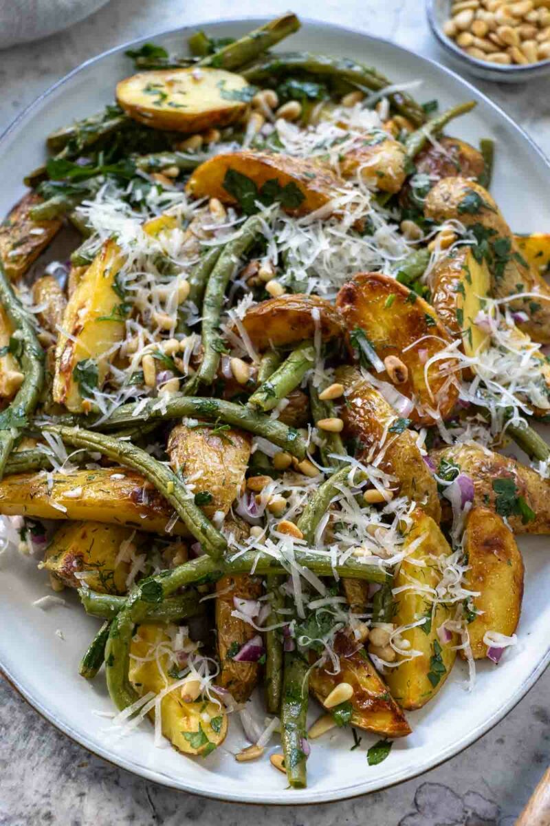 Roasted Potatoes and Green Beans with lemon-garlic dressing, finished with fresh herbs, toasted pine nuts, and a scattering of Parmesan.