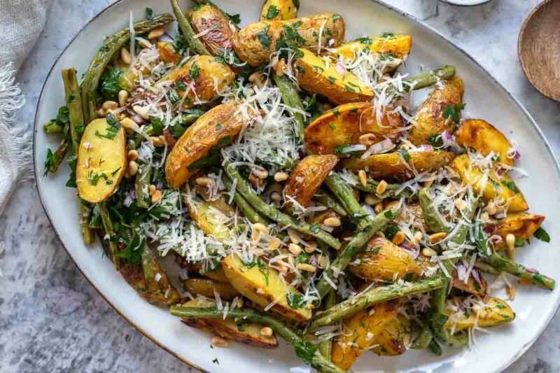 Roasted Potatoes and Green Beans with lemon-garlic dressing, finished with fresh herbs, toasted pine nuts, and a scattering of Parmesan.