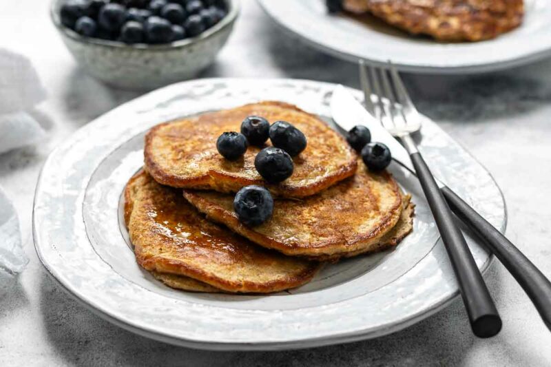 Oat Pancakes with Cottage Cheese served with maple syrup and blueberries