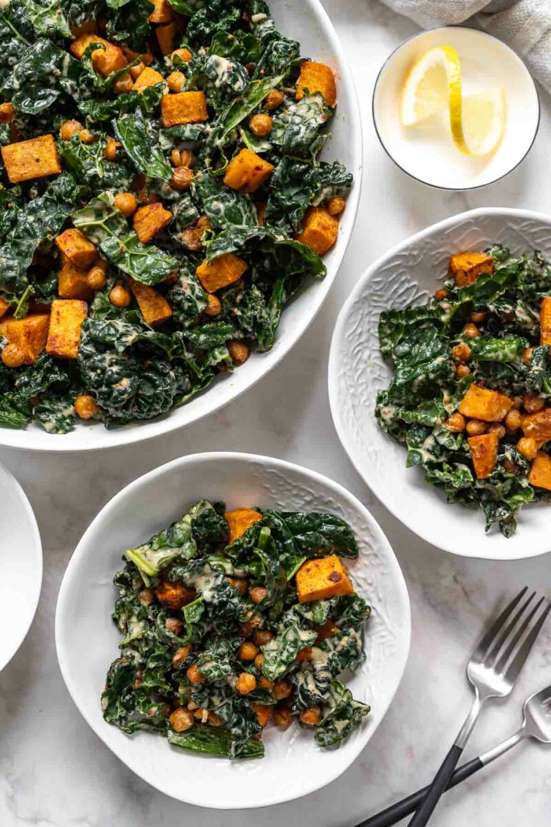 Vegan Kale Caesar Salad with roasted Sweet Potato & Chickpeas and lemon tahini dressing with nutritional yeast for signature flavour